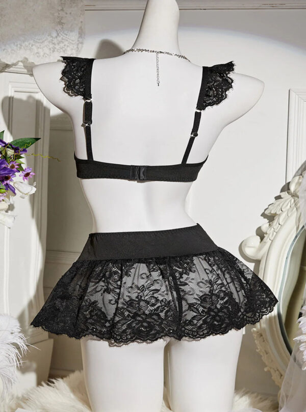 Ensemble lingerie sexy jupe dentelle et nœuds noir - mannequin arrière Ensemble lingerie sexy noir sur mannequin, vue arrière